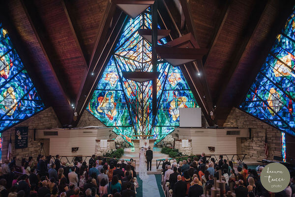 Tampa Bay wedding ceremony in front of an incredible stained glass window