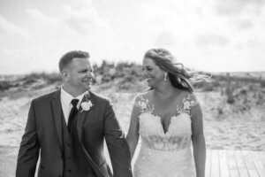 Black and white photo of a newlywed couple on Clearwater Beach