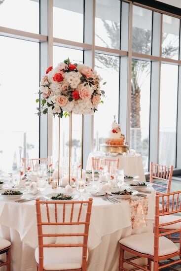 Rose gold and white wedding decor at an Opal Sands wedding