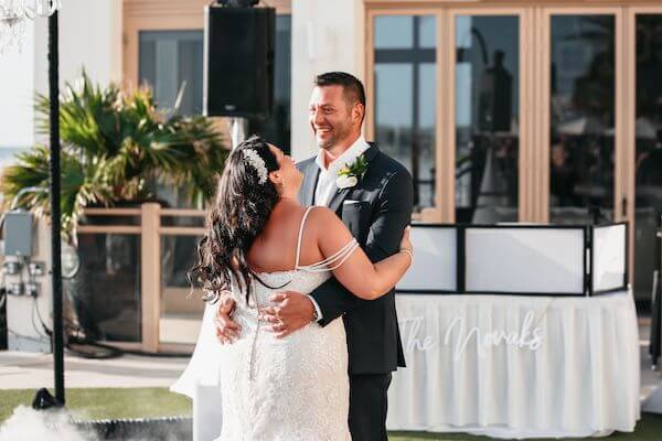 Bride and groom's first dance after their Sandpearl Resort wedding ceremony