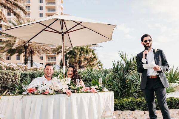 Wedding toast on the gulf lawn at the Sandpearl Resort