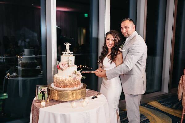 Bride and groom cutting their wedding cake at the Opal Sands Resort