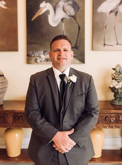 Handsome groom in the lobby of the Sandpearl Resort