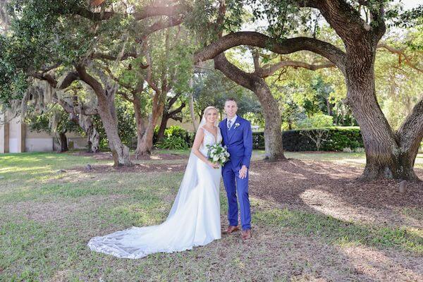 Bride and groom posing for photos after their Tampa Garden Club wedding