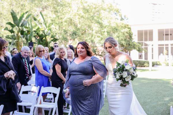 Tampa bride walking down the aisle with her mother at the Tampa Garden Club