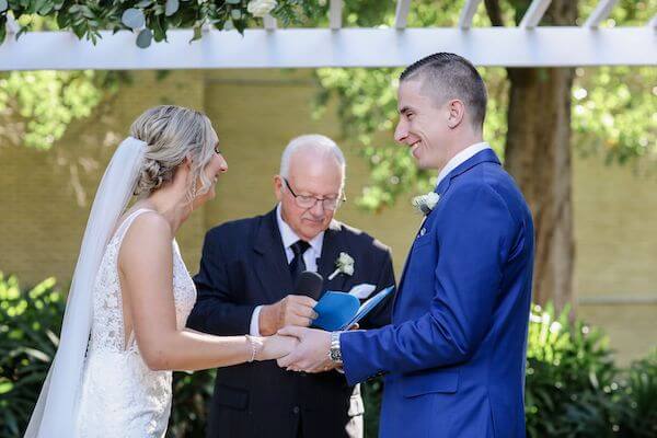 Tampa couple exchanging wedding vows at the Tampa Garden Club