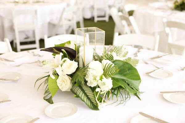 Gold, and white tables capes for a Clearwater Beach tented wedding reception