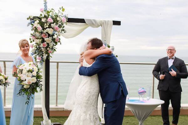 Bride and groom embraces after their I Dos