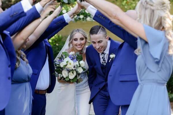 Tampa bride and groom taking photos with their wedding party