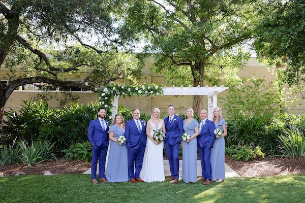 Tampa bride and groom taking photos with their wedding party