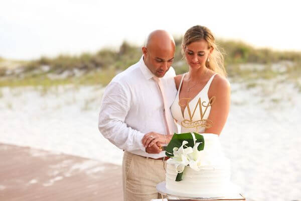 Bride and groom cutting their wedding cake