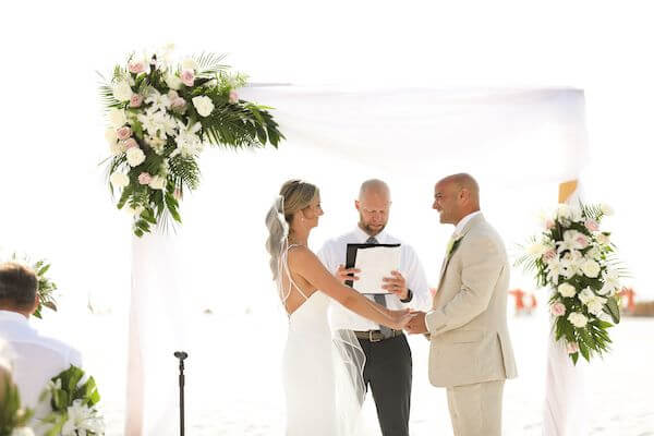 Couple exchanging wedding vows on Clearwater Beach