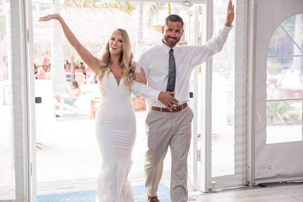 Bride and groom entering their St. Pete Beach wedding reception