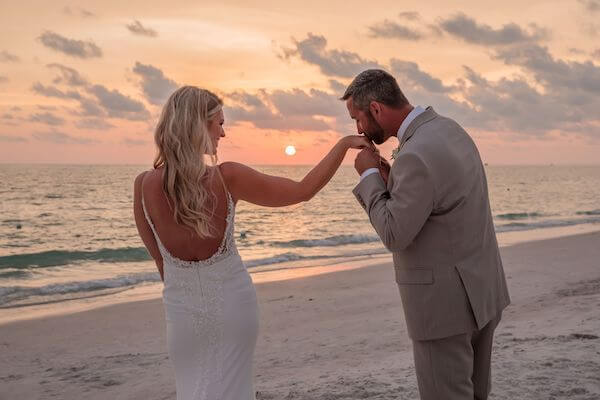 Bride and groom at sunset on St. Pete Beach