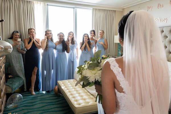 Bridal party seeing the bride for the first time