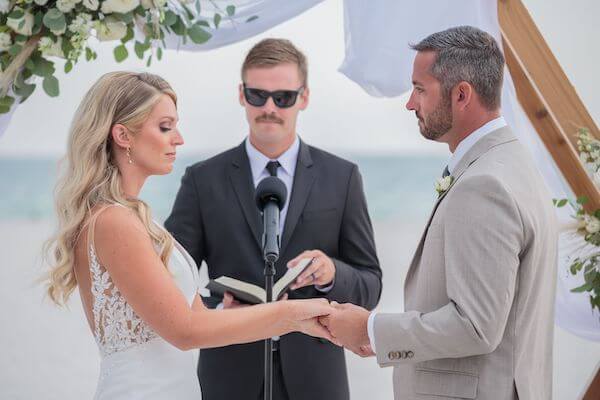 Bride and groom exchanging wedding vows on St. Pete Beach