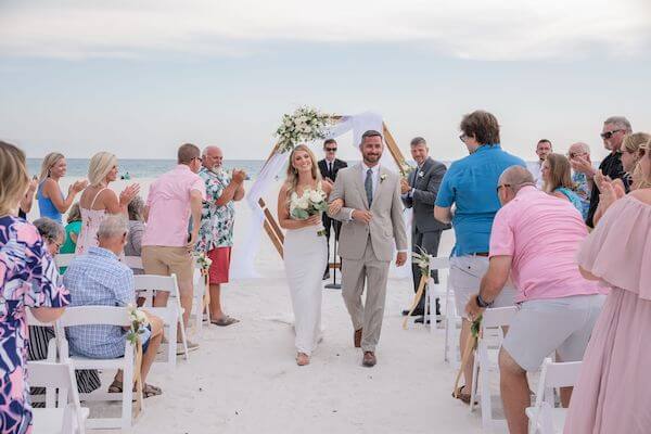 Just Married! Bride and groom leaving their St. Pete Beach wedding ceremony