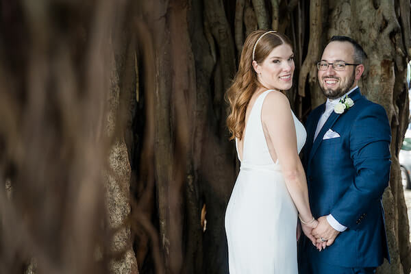 Bride and groom taking photos after their intimate wedding at The Birchwood