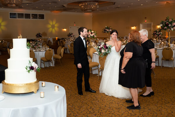 Bride and groom, along with Special Moments Event Planning team, take a sneak peek at their InnisBrook Golf Resort wedding reception