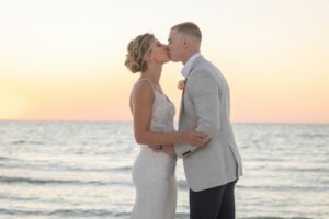 Bride and groom kissing on Clearwater b