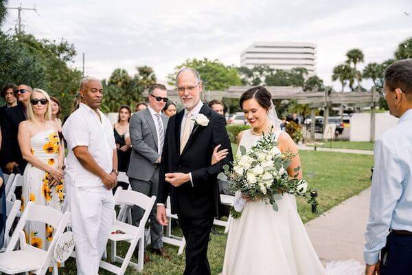 Tampa bride walking down the aisle at the Rusty Pelican