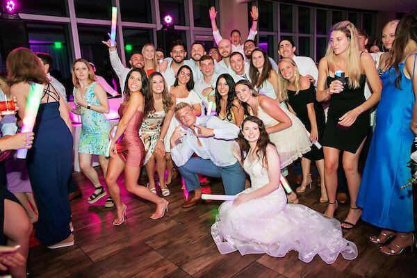 Bride and groom on a packed dance floor