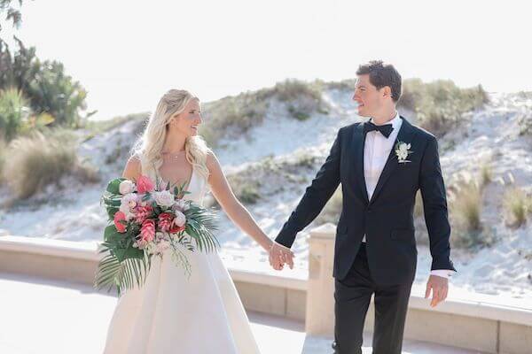 Bride and groom on the walkway along Clearwater Beach.