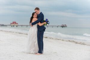 Bride and groom embracing on Clearwater Beach