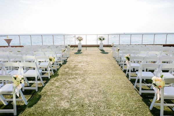 White and Pink outdoor wedding ceremony at the Opal Sands Resort