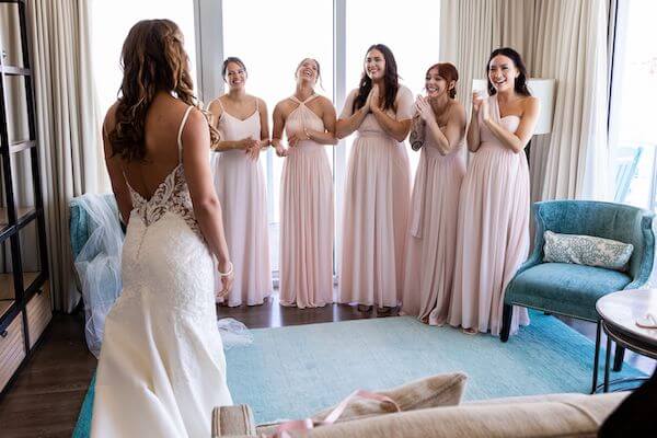 The bridal party seeing the bride for the first time