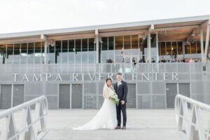 Bride and groom in front of the Tampa River Center