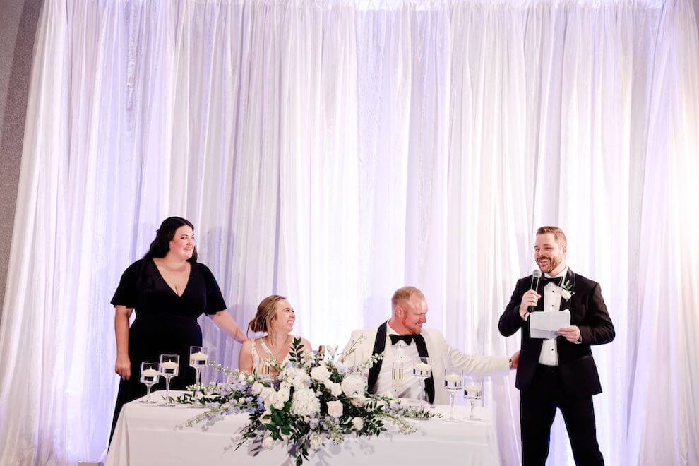 Honor attendants toasting the bride and groom 