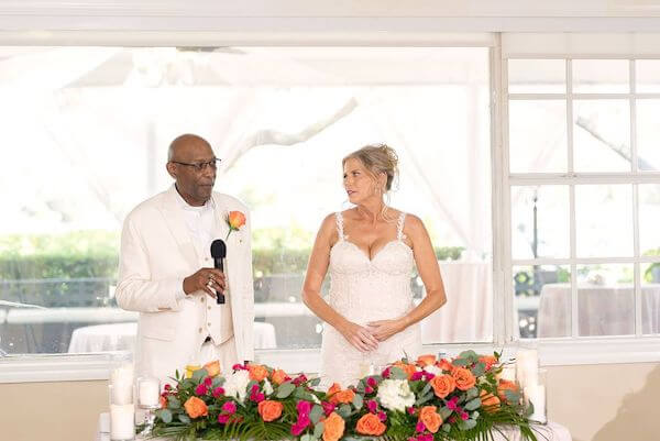 Bride and groom welcoming guests to their Tampa wedding 