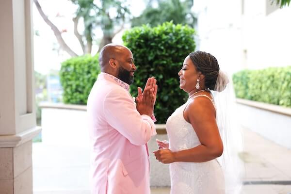 Bride and groom outside of the Sandpearl Resort