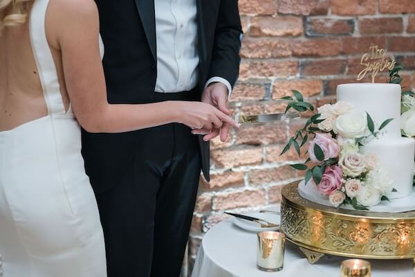 Bride and groom cutting their wedding cake