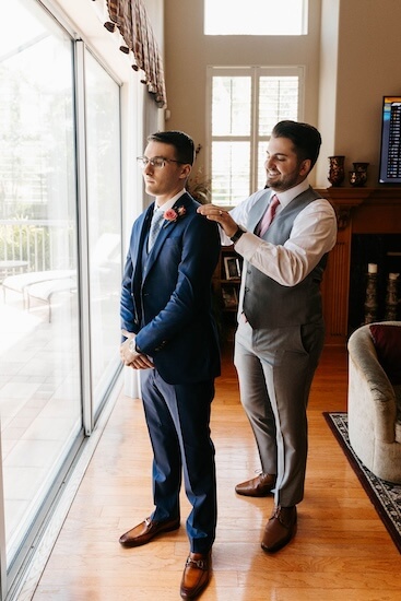 Groom getting dressed for his wedding at the Tampa Garden Club