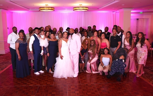 Photo of all of the guests at an intimate Sandpearl wedding 