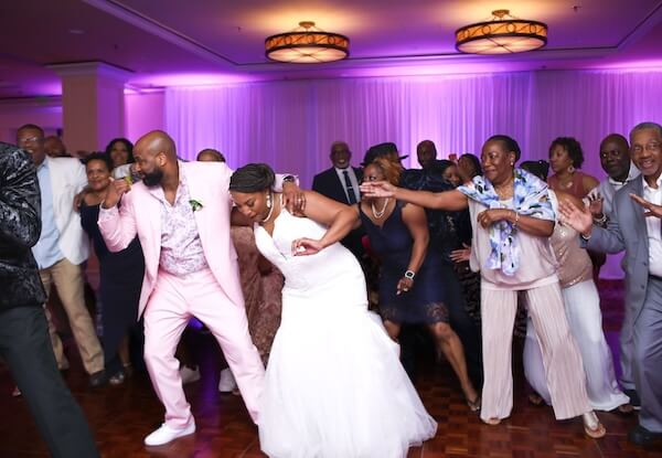 Bride and from dancing with guests at their Sandpearl wedding reception 