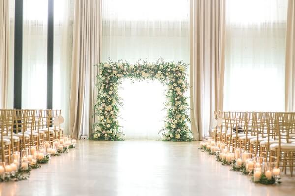 Gold, pink and white ceremony decor for an Ybor City wedding at the Hotel Haya.