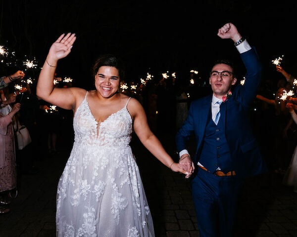 Bride and groom's grand exit under a shower of sparklers outside the Tampa Garden Club