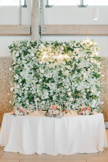 Floral wall with the bride and groom's last name at the Tampa River Center