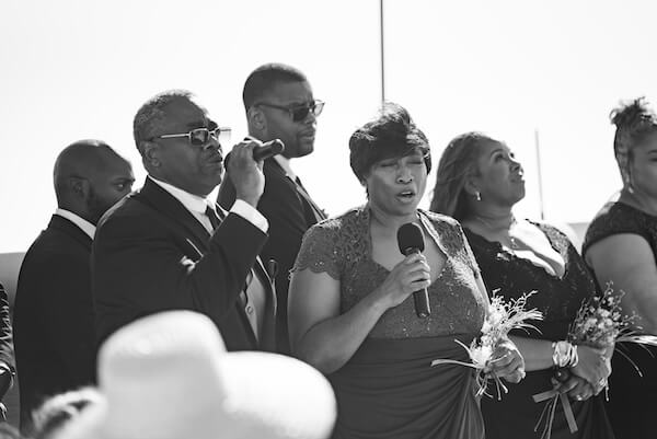 Family and friends singing at a Clearwater Beach wedding