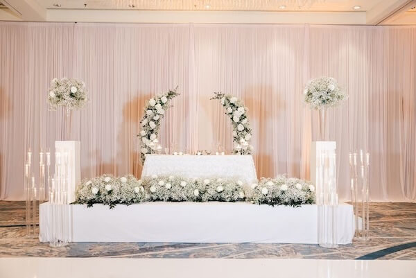 Two-tiered white sweetheart table for a downtown Tampa wedding.