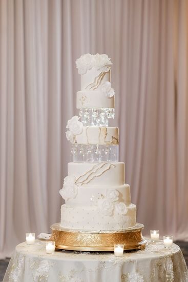 Five-tiered white wedding cake for a downtown Tampa wedding reception. 