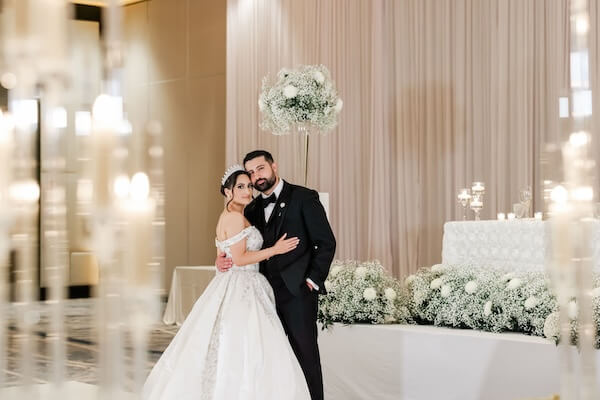 bride and groom posing for photos before their downtown Tampa wedding reception.