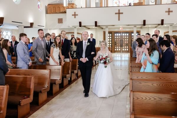 Tampa Bay bride walking down the aisle with her father.