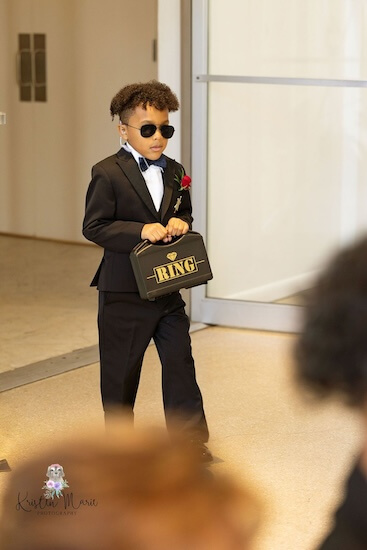 Ring bearer walking down the aisle