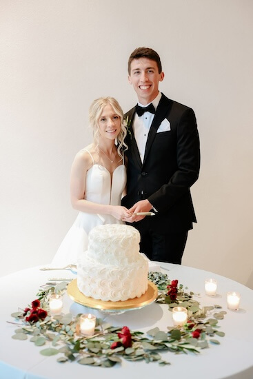 Bride and groom cutting their wedding cake