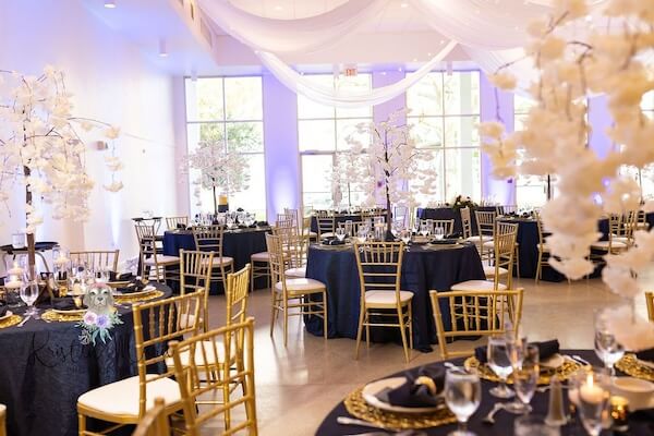 Navy, white and gold wedding reception decor at the Tampa Garden Club