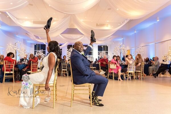 Bride and groom playing the shoe game